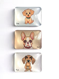 Three rectangular glass fridge magnets with rounded corners, stacked vertically. Each coaster features a different cartoon dog illustration: a tan puppy, a French Bulldog, and a dachshund, all with the name 'Punk' written in black script near the bottom left of their respective designs.