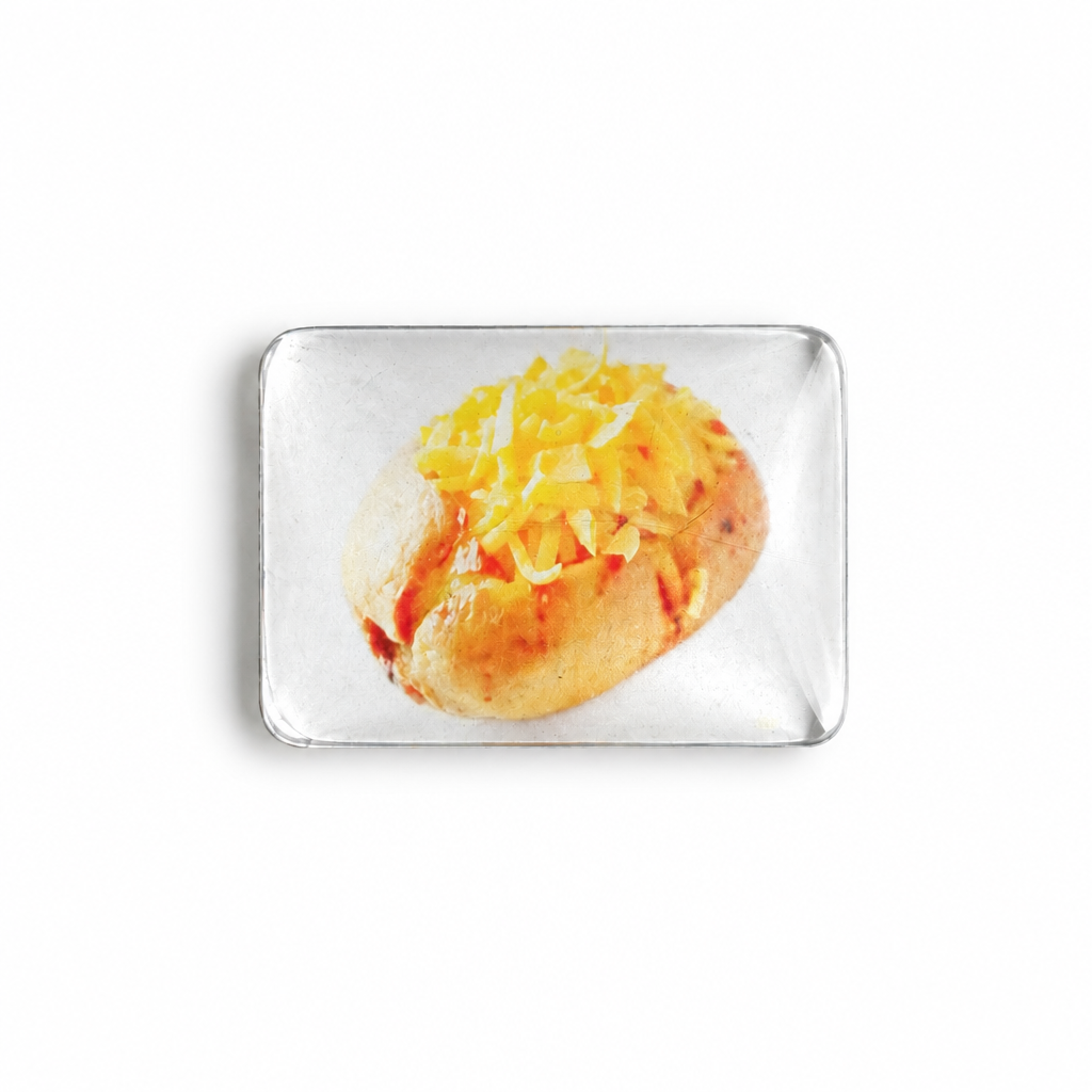 Crystal glass baked potato fridge magnet on a white background